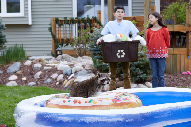 Two kids in front of kiddie pool