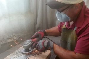 Man creating art from recycled metal