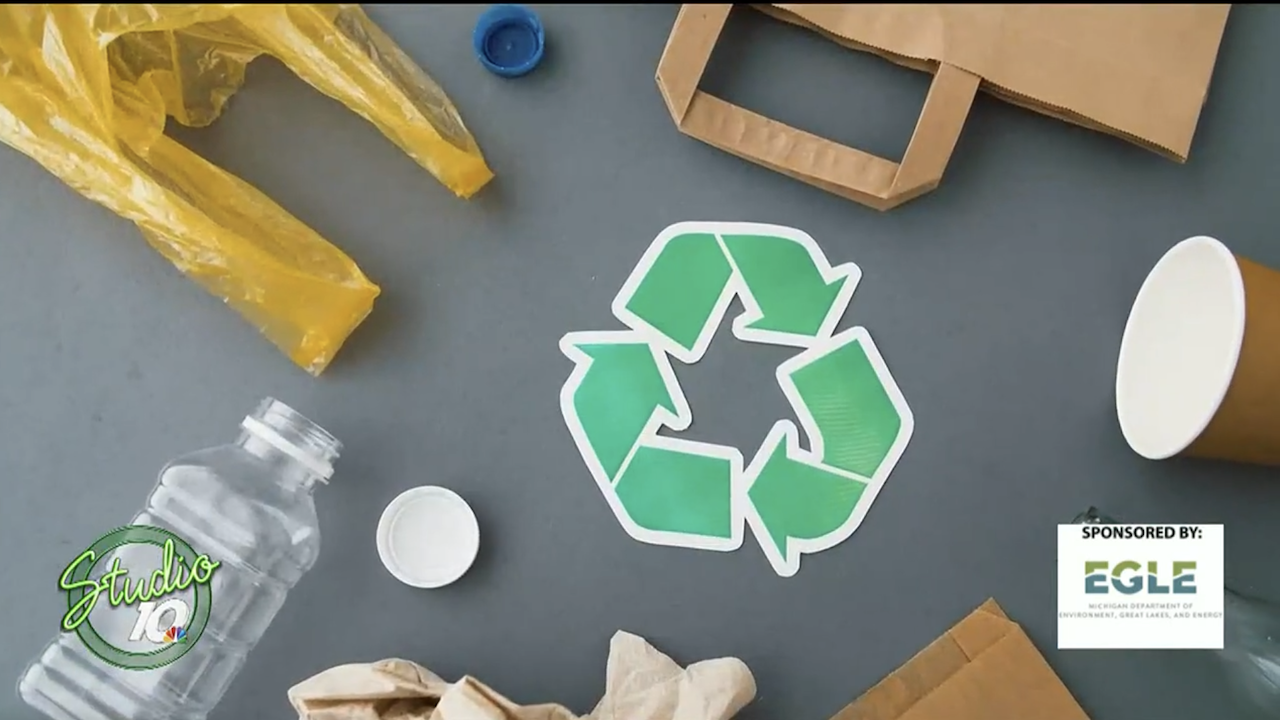 A recycling symbol surrounded by recyclable materials